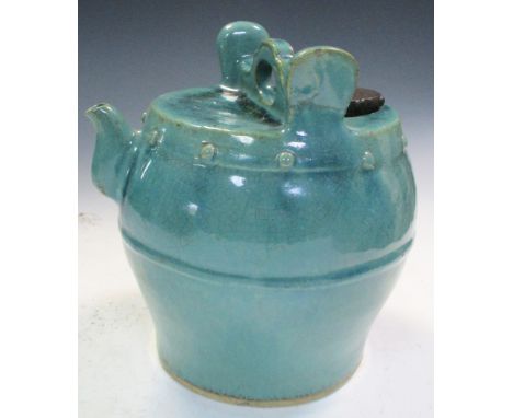 A Ming turquoise glazed water vessel with later stopper, a carrying handle to the top of the barrel shape raised between auri
