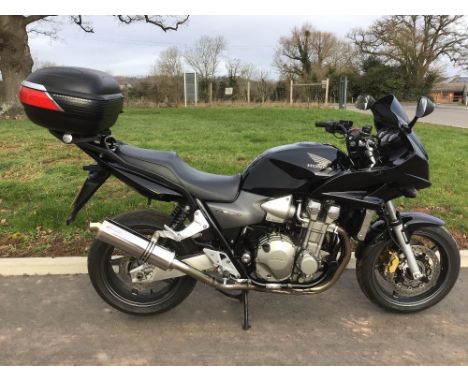 Honda CB1300 motorcycle. 2007. Runs and rides well. Givi Maxia top box and original silencer. Comes with 2 keys, 2 spare scre