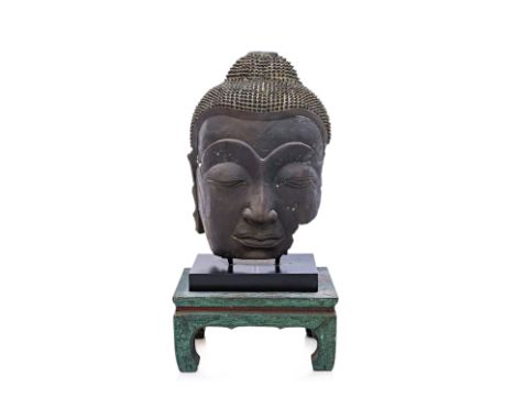 A LARGE SOUTH-EAST ASIAN BRONZE BUDDHA HEAD
Cast bronze, with custom stand and additional Chinese green painted timber stand
