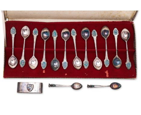 A GROUP OF AUSTRALIAN SILVER SPOONS AND A NAPKIN RING
Comprising: a set of twelve teaspoons, with opal set terminals, in a fi