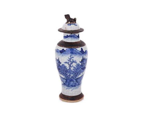 A BULE AND WHITE VASE AND COVER
Nanjing style baluster vase decorated in landscape of pine trees buildings and mountains, cir