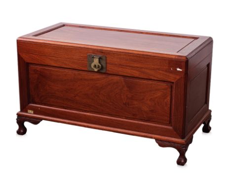 A SINGAPOREAN CAMPHOR LINED ROSEWOOD TRUNK
Hinged cover and raised on carved bracket feet, the interior with slatted lift out