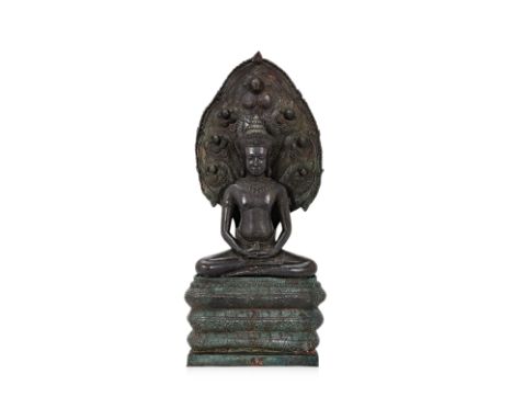A SOUTHEAST ASIAN BRONZE BUDDHA FIGURE
Buddha modelled in the lopburi style, enthroned and protected by Naga
66cm high
Condit
