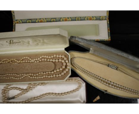 A JADE PAGE TURNER PLUS THREE CASED FAUX PEARL NECKLACES