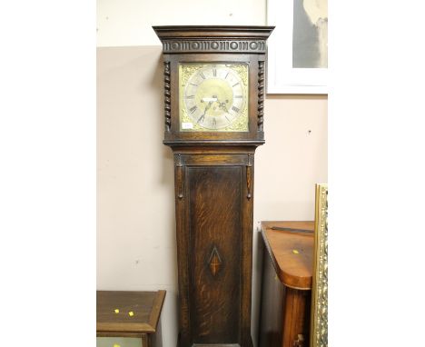 AN EARLY 20TH CENTURY OAK LONGCASE CLOCK WITH BARLEYTWIST DETAIL