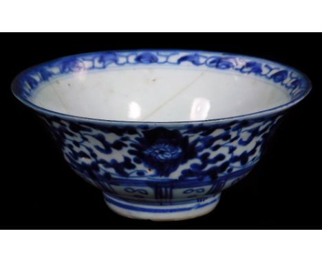 A Chinese blue and white porcelain Kangxi style bowl, the circular bowl decorated with flowers on a circular foot, seal mark 