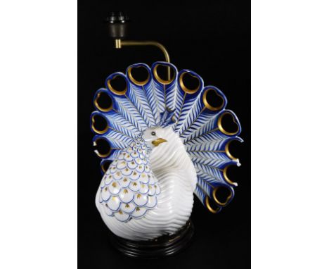 A 20thC semi-porcelain peacock lamp, with gilt highlights, unmarked, 44cm H.