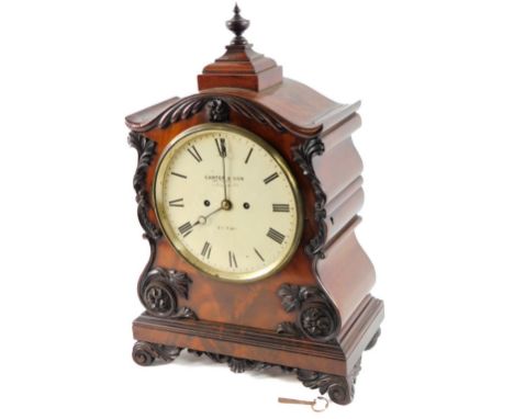 John Carter &amp; Son Cornhill, London. An early 19thC mahogany bracket clock, with a swept case set with various scroll and 