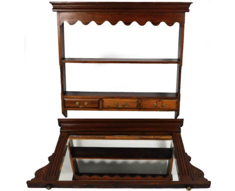 A 20thC mahogany stained hanging plate rack, with a carved frieze above open shelf and three spice drawers, 101cm H, 103cm W,