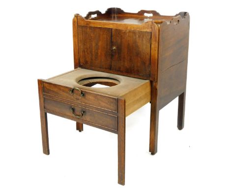 An early 19thC mahogany night commode, with pierced carved gallery top, raised above double cupboards and two drawers with a 
