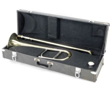 A Stagg 77-Taj brass two piece trombone, no. H0787D, with separate mouth piece, in fitted case, 73cm W.