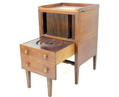 An early 19thC mahogany night commode, with galleried top raised above a tambour front and two drawers, with pull out commode