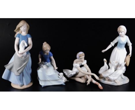 Various Nao figures, girl holding rabbit, 28cm H, another girl with puppies, Lladro figure of a ballerina no.2591, printed an