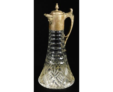 An Elizabeth II silver and cut glass claret jug, with trumpet shaped stem, angular scroll handle and urn finial with Bacchus 