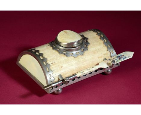 Natural History: An inkwell made of ivory with metal mounts together with an associated ivory handled pen  late 19th century 