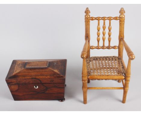 A doll's turned wood spindle back chair with cane seat, 12" high, and a rosewood sarcophagus tea caddy, 8" wide (for restorat