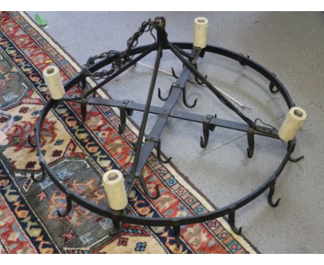 A late 19th century wrought iron circular game hanger, now converted as a ceiling light pendant, 34" dia 