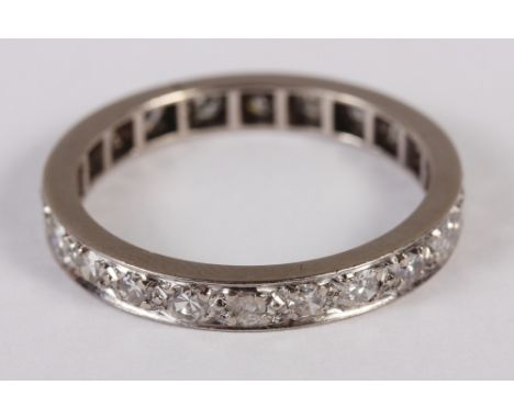 A white metal and diamond set full eternity ring. Size O