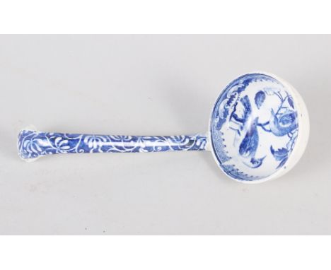 A 19th century blue and white ladle, decorated birds and flowers, 7" long 