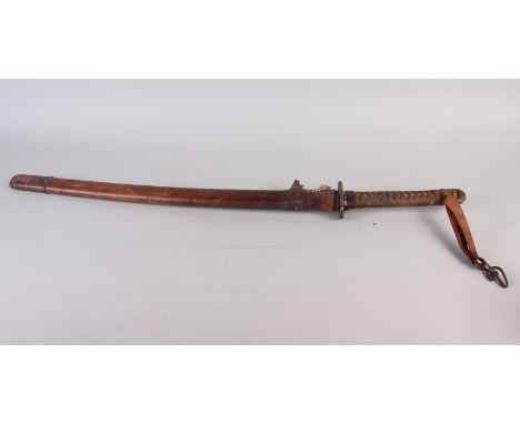 A Japanese WWII military issue Katana with brown leather scabbard, the blade signed under handle grip, 31" long overall, leng