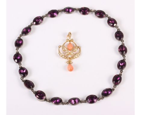A late Victorian coral and split pearl yellow metal pendant, stamped 15, 3.2g, and a child's white metal and amethyst coloure