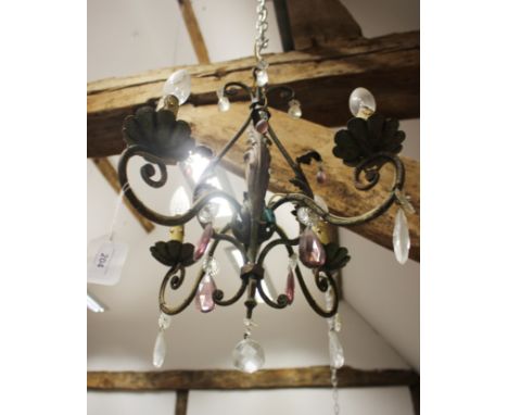 A 19th century wrought iron scroll work four-light chandelier, now converted to electricity, 14" wide x 19" high, and a simil