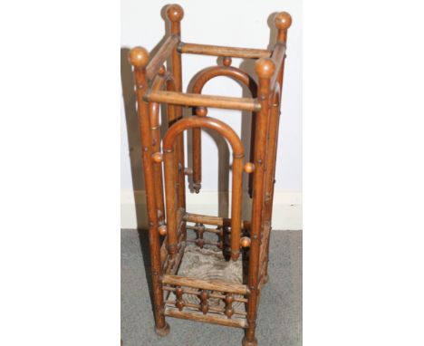 A late 19th century ash and bentwood brass mounted stick stand, on ball feet, 9" square x 29" high (drip tray rusted) 