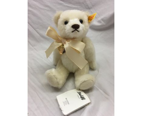 STEIFF MEMORIES BEAR YELLOW TAG WITH RED WRITING, CREAM MOHAIR, 23CM. INSCRIBED ON REVERSE OF HEART - 'THOSE THAT WE LOVE NEV