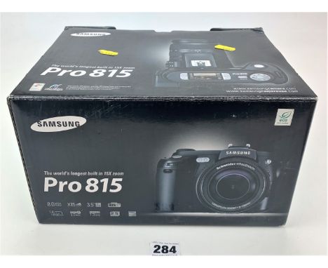 Samsung Pro 815 digital camera in box with strap, accessories and instructions