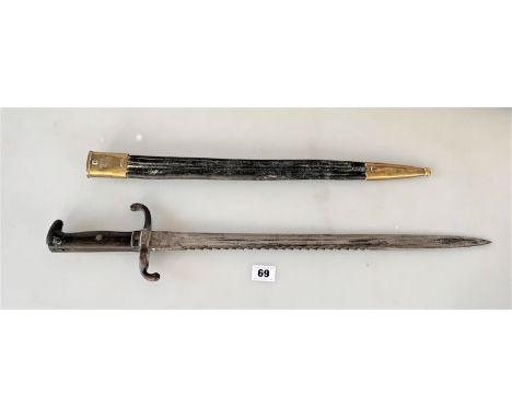 Bayonet with serrated edge in leather scabbard. Marked on blade Alex Coppel Solingen. Marked on hilt B.11.R.7.9. Marked on br