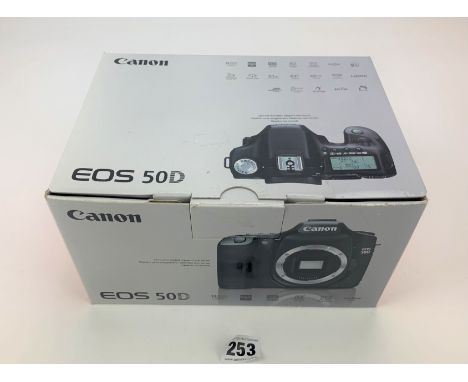 Canon EOS 50D digital camera in box with charger, strap, accessories and instructions
