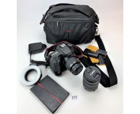 Canon EOS 70D digital camera with light meter, strap, Canon lens EFS 18-135mm and accessories in camera bag