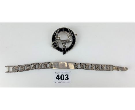 Silver ID bracelet, 8.5” long, w: 1.4 ozt and plated/black enamel brooch with deer design, 1.75” diameter