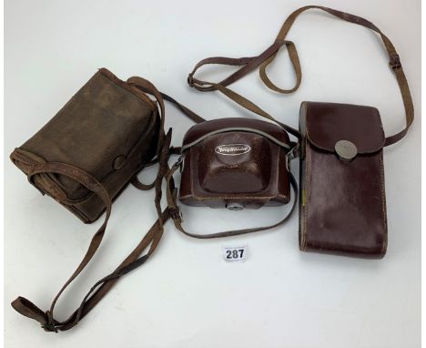 Voigtlander Bessamatic camera in case, Ensign 320 Selfix in case and Eastman Kodak Box Brownie 120, Made in Canada in case