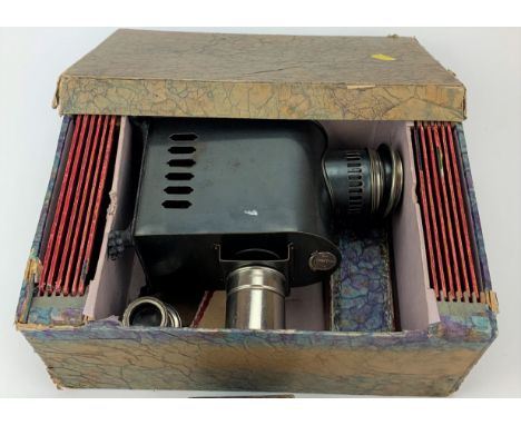 Antique J.F. Magic Lantern camera made in Germany in box with lens, kaleiodoscope slide, one box of Magic Lantern slides and 