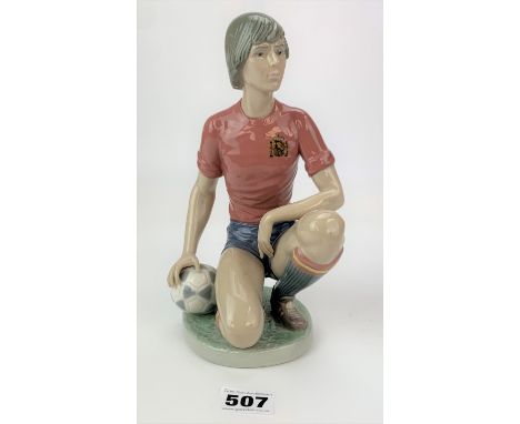 Lladro figure of kneeling footballer with ball, 9” high