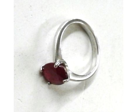 A silver and simulated ruby set ring