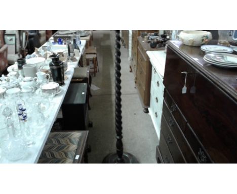 An oak barley twist standard lamp
