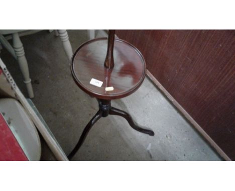 A mahogany standard lamp table 