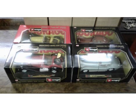 Four Burago model cars in original boxes 