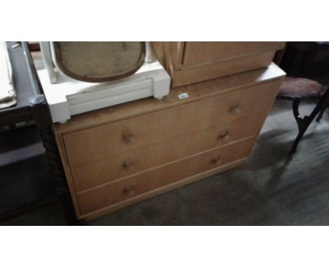 A light oak veneered three drawer chest; and matching bedside cupboard&nbsp;