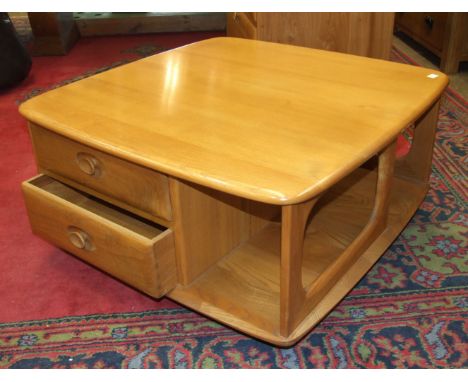 An Ercol low coffee and book table fitted with two drawers, 80cm square and a matching television cabinet, (2).