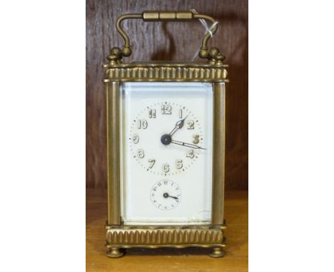 A late-19th/early-20th century small French carriage alarm timepiece with white enamel dial, 13cm high, (chips to glass panel