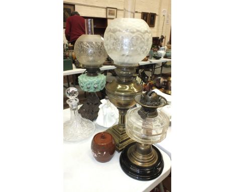 A late-19th/early-20th century oil lamp with green glass reservoir, two other oil lamps, plated ware and miscellaneous cerami