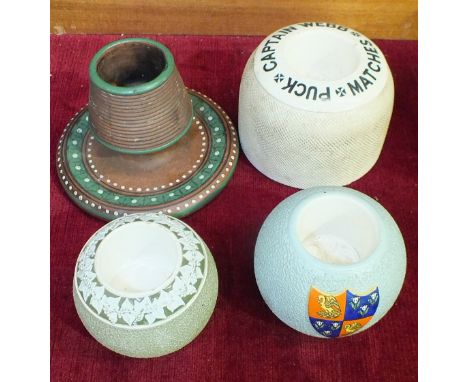 A Fieldings ceramic match holder/strike, 'Captain Webb Matches Puck', 8cm high, two Carltonware match strikes of ceramic ball