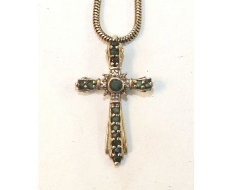 A 9ct gold cross pendant set emeralds and diamond points, on 9ct gold snake-link chain, 7g.