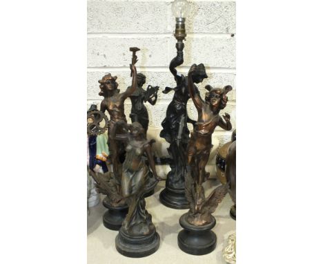 A collection of four spelter figures and a bronzed metal table lamp, (5).