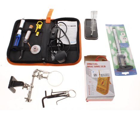 Selection of guitar spares and accessories to include a set of guitar tuners, a digital multi-meter, an electronic digital ca