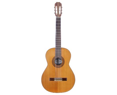 Kiso Suzuki 9500 classical guitar; Back and sides: mahogany, light dings and marks; Top: natural spruce, a few minor dings bu