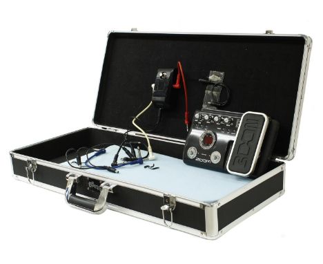 Zoom G2.1U guitar effects pedal; together with a Korg Pitch Black chromatic tuner within a Stagg pedal board flight case  *Pl